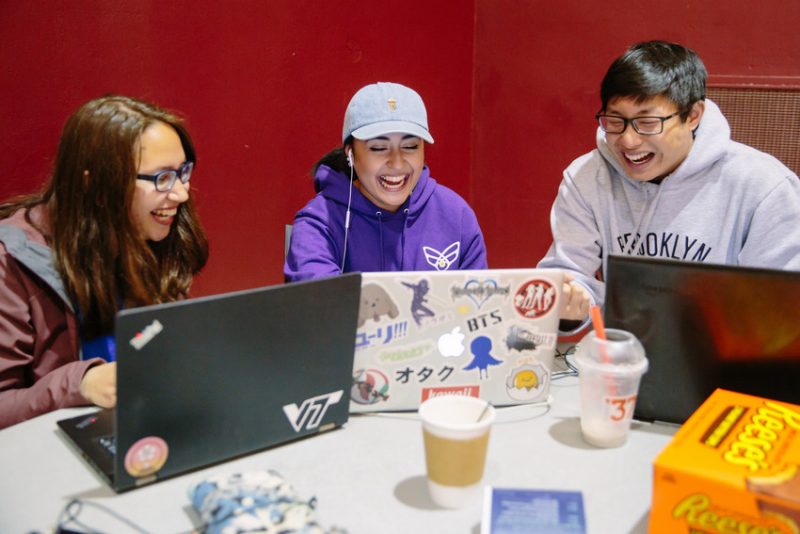 3 students sitting at a computer